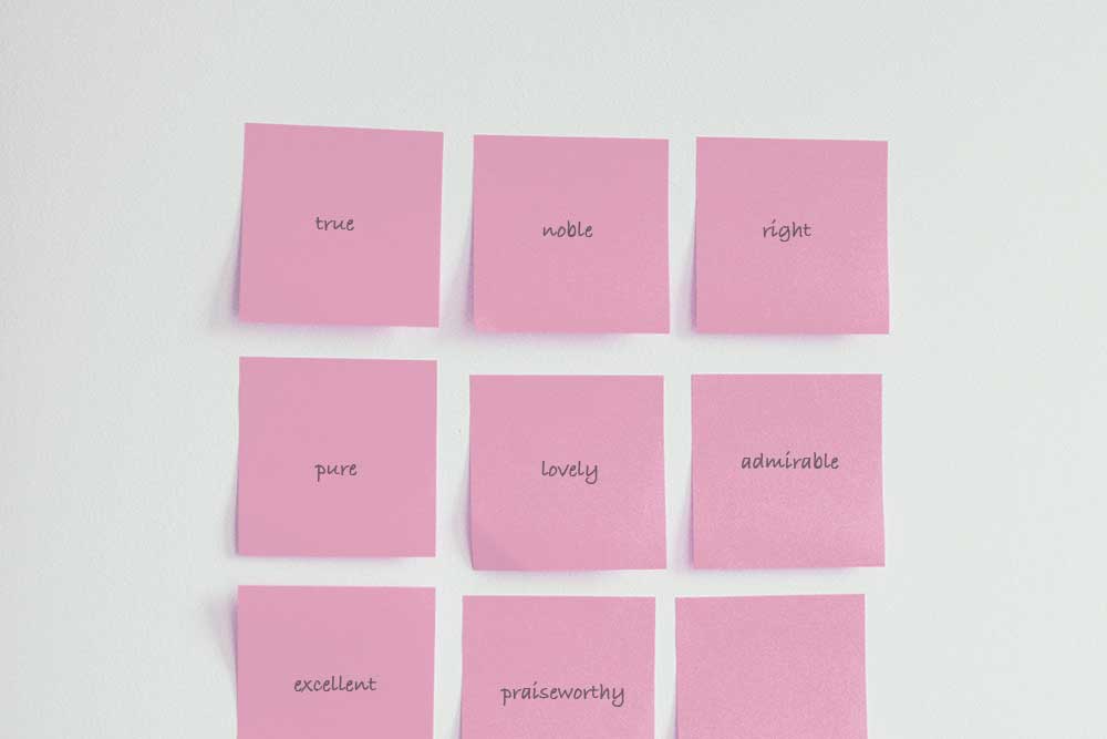 pink sticky note grid with one word on each