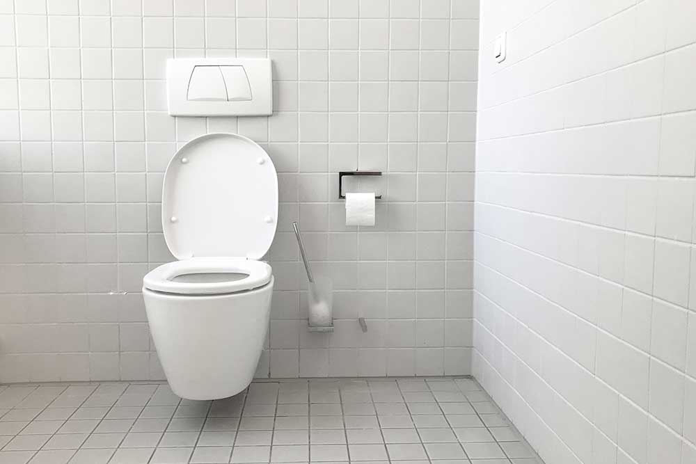 clean bathroom stall white toilet