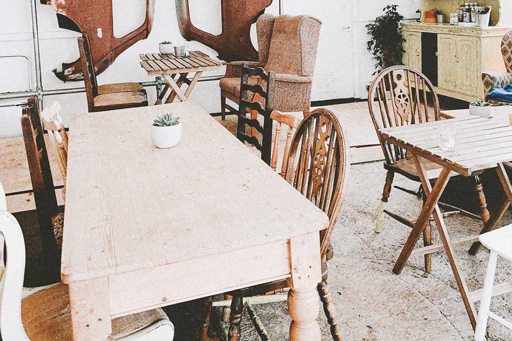 wood tables surrounded by chairs