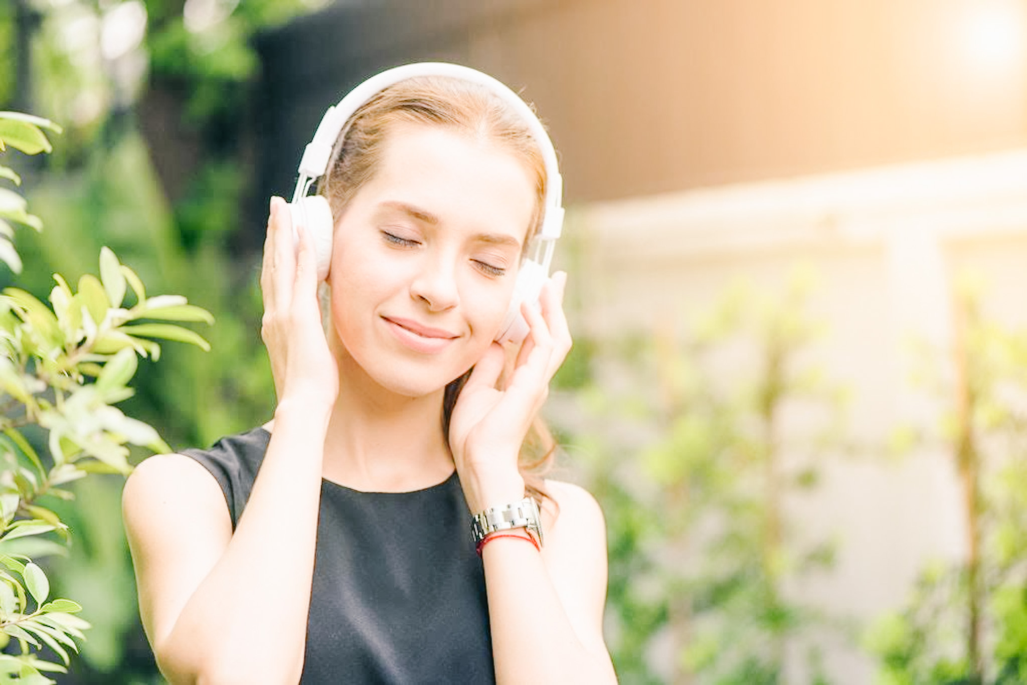 Girl listening to music in the sun
