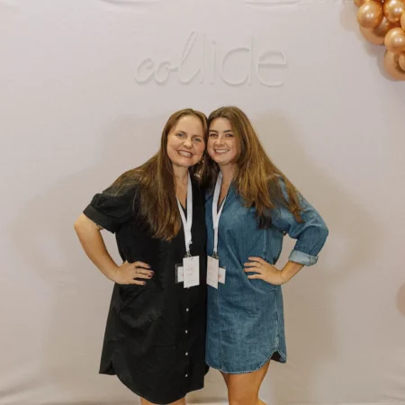 Two women posing with each other at Collide Conference.
